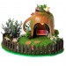 Miniature fairy garden house in tea cup room inside 