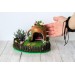 Miniature fairy garden house in tea cup room inside 