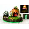 Miniature fairy garden house in tea cup room inside 