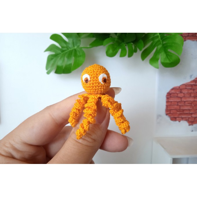 Miniature crochet octopus with hand painted eyes