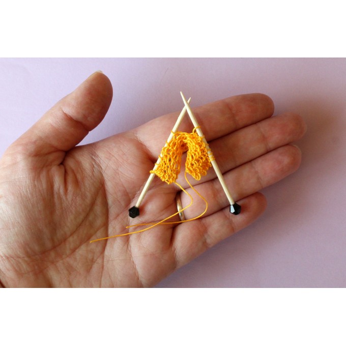 Miniature needles with knitting yarn many colors