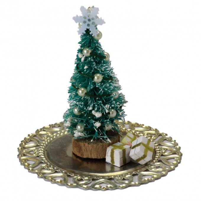 Miniature Christmas tree with presents on the tray. Doll