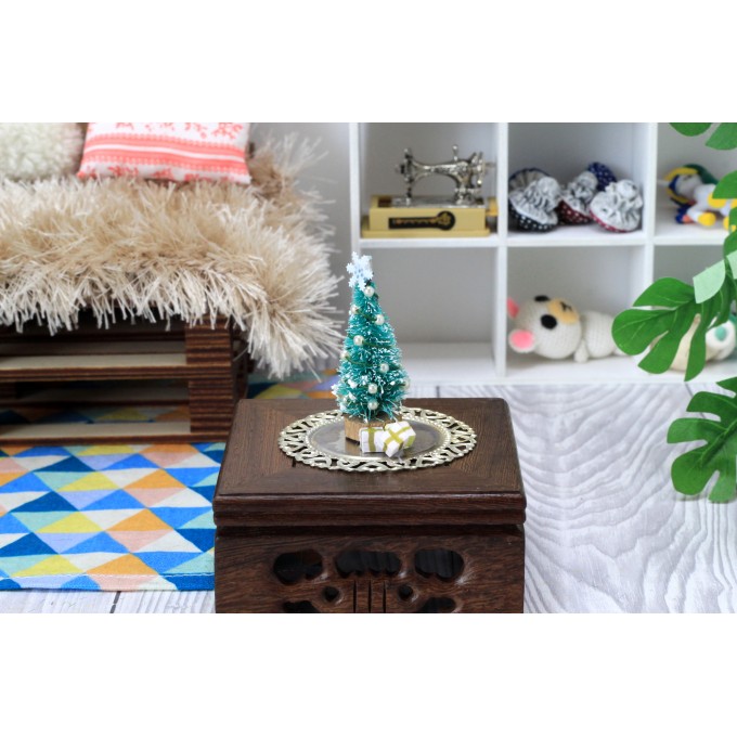 Miniature Christmas tree with presents on the tray. Doll