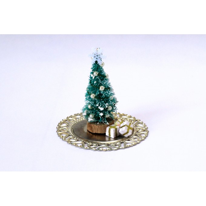 Miniature Christmas tree with presents on the tray. Doll
