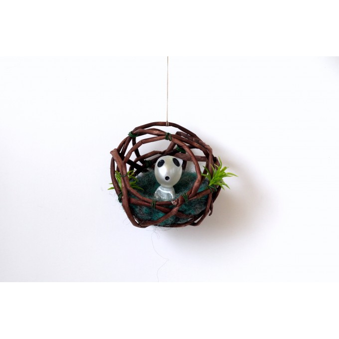 Miniature ghost sitting in the nest, dollhouse fairy forest