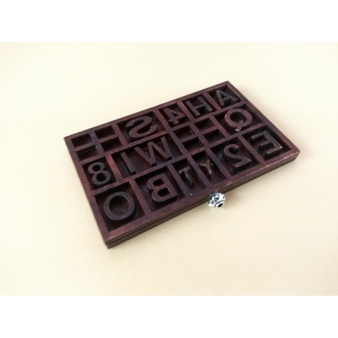 Miniature typography drawer with letters. Old