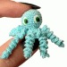 Miniature crochet octopus with hand painted eyes