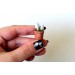 Miniature potted mushrooms with grass. Tiny dollhouse