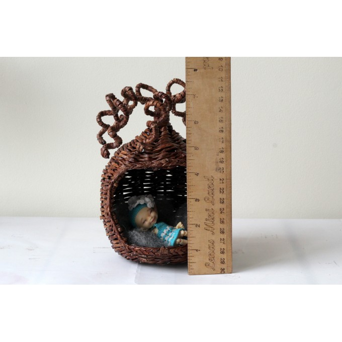 Miniature wicker hanging chair hideout with curled 