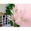 Dollhouse pink plant in the white pot with grass. Miniature 