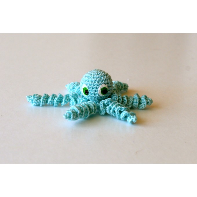 Miniature crochet octopus with hand painted eyes