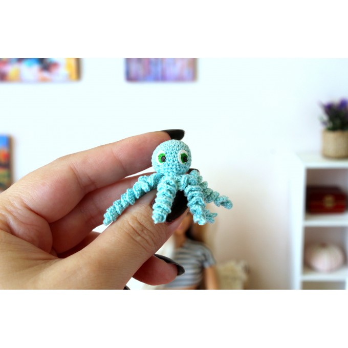 Miniature crochet octopus with hand painted eyes